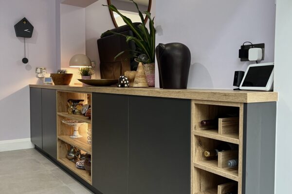 Caneo dark graphite cabinetry with Alabama natural oak worktop, open shelving and integrated wine storage